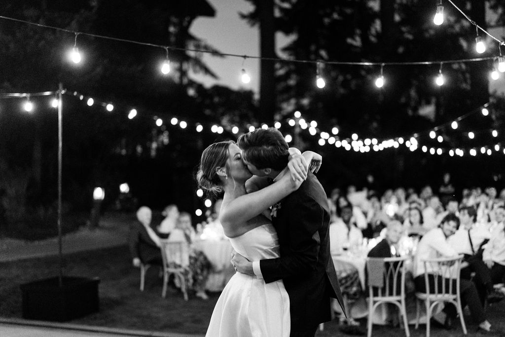 Black and white image of bride and groom during first dance at Alderbrook Resort