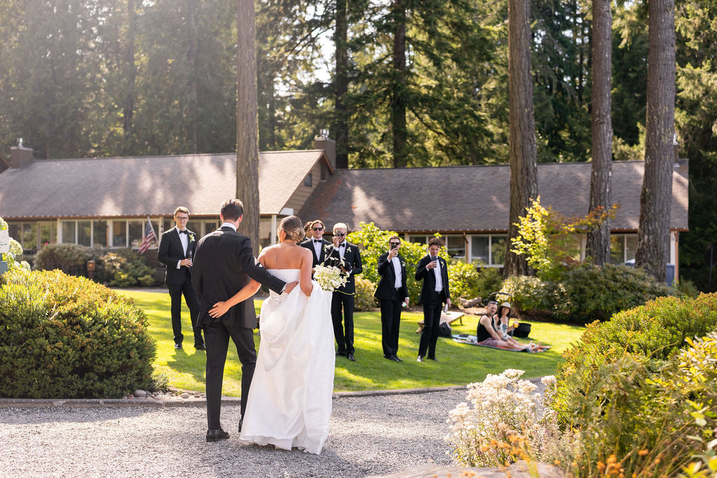 bride and groom walk towards their bridal party before their ceremony during Alderbrook Resort wedding