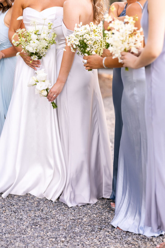 bride with her bridesmaids and bouquets