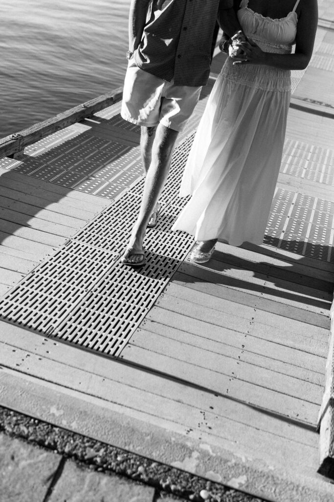 bride and groom walking on dock