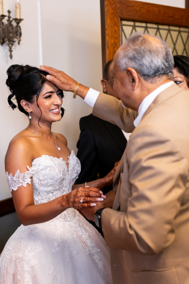 Bride and uncle indian prayer wedding ceremony