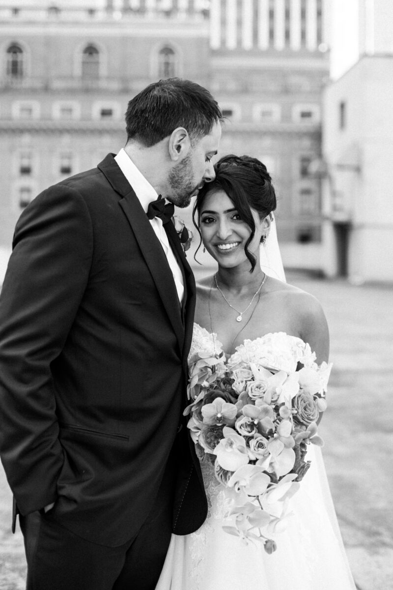 Bride and groom on rooftop in downtown seattle