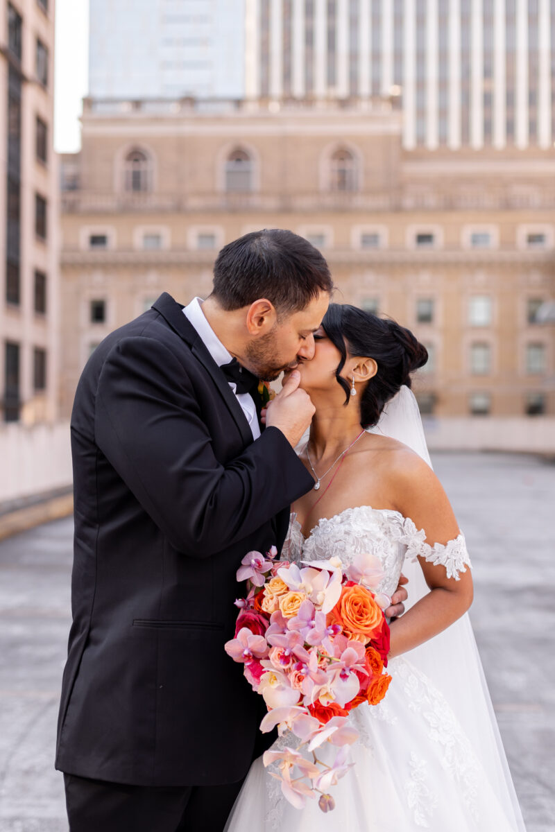 Bride and groom on rooftop in downtown seattle