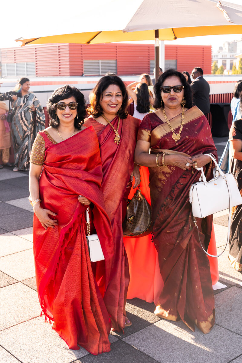 Rooftop seattle waterfront cocktail hour wedding - Indian wedding mom and auntie in saris