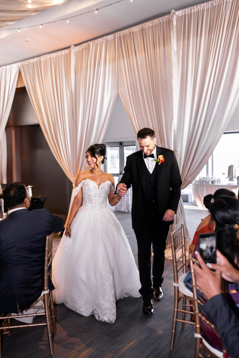 Bell Harbor Conference Center wedding in downtown Seattle couple seeing reception space with grand entrance