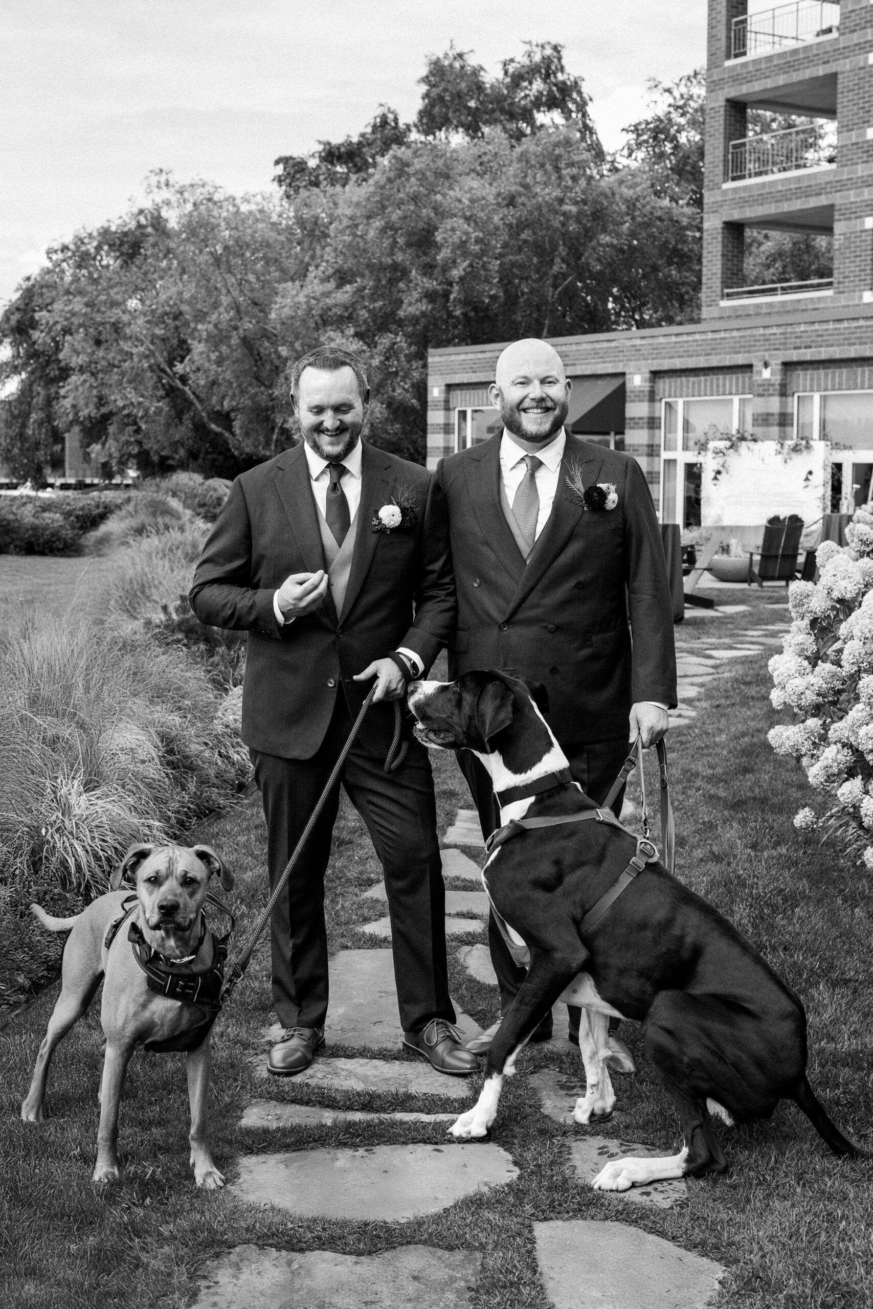 two grooms with dogs at woodmark hotel