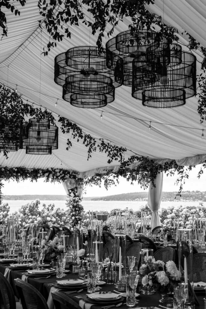 Black and white detail photo of dinner set up under the tent at woodmark hotel