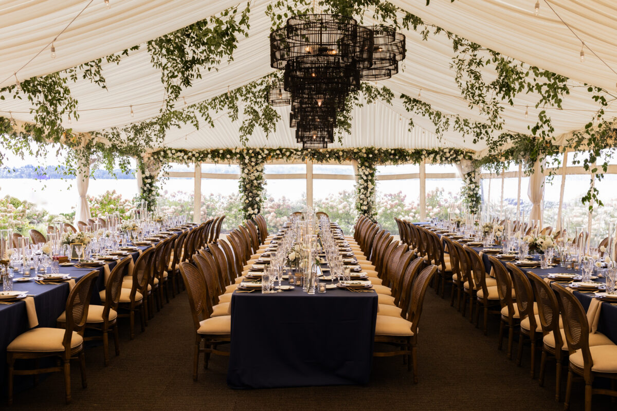 woodmark hotel reception tent set up with white and blue florals