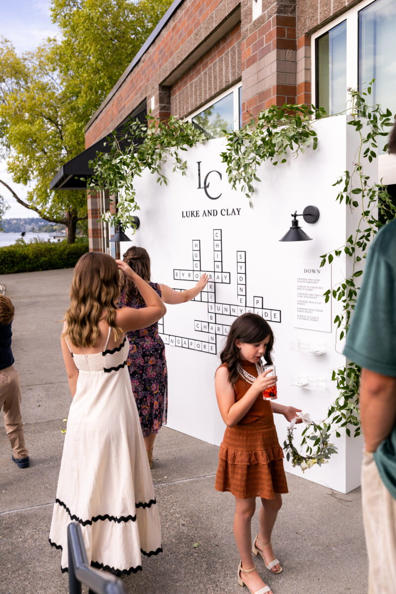 Guests playing word search installation at woodmark hotel rceception