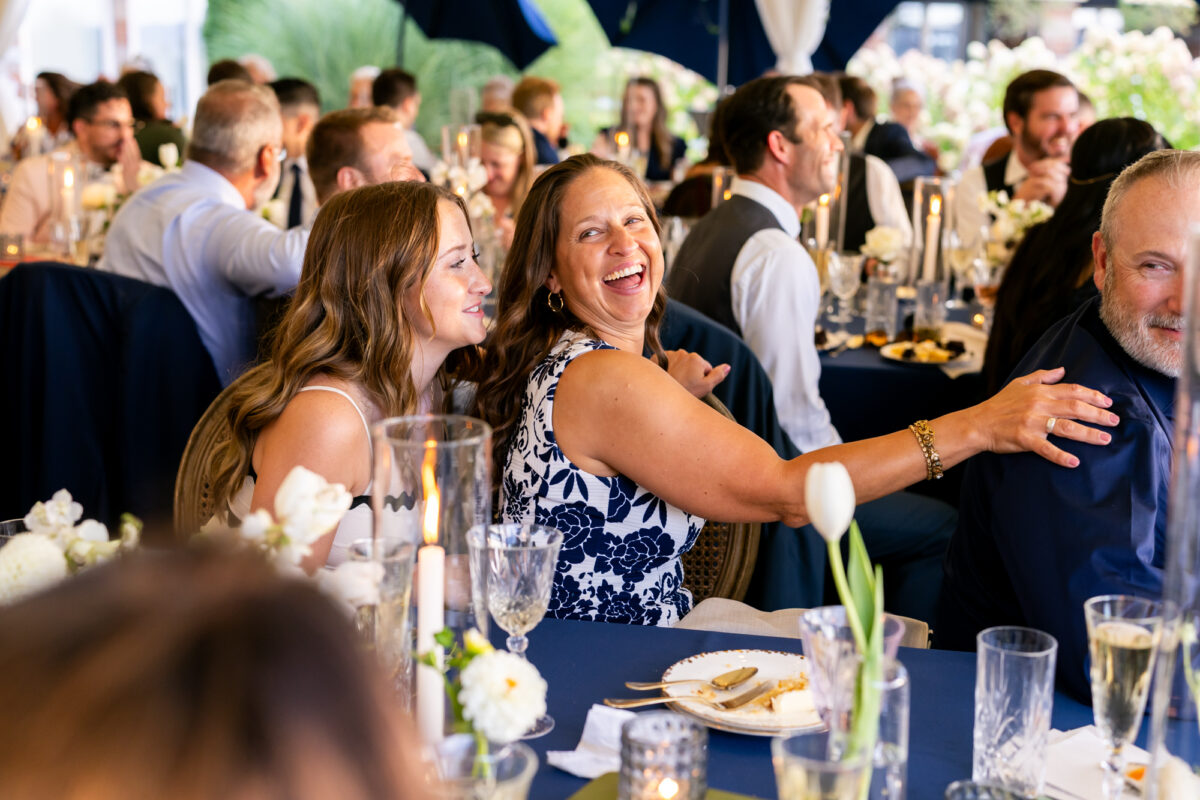 Guests laughing during wedding speeches