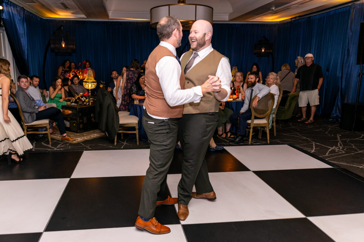 two grooms having first dance during woodmark hotel wedding reception
