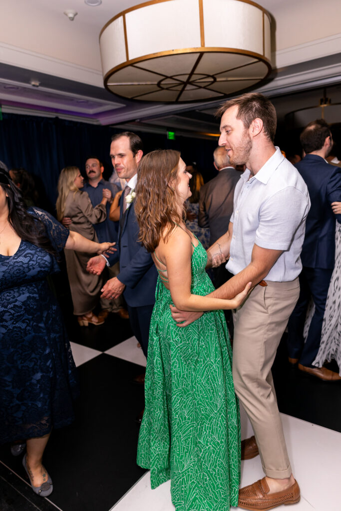 guests dancing during reception on checkered dance floor