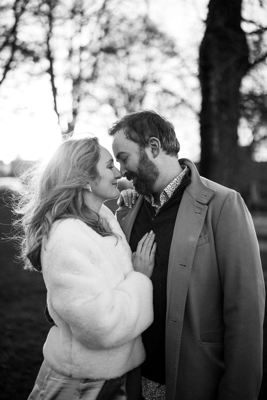 Black and white photo of couple during Alki Beach engagement session in Seattle