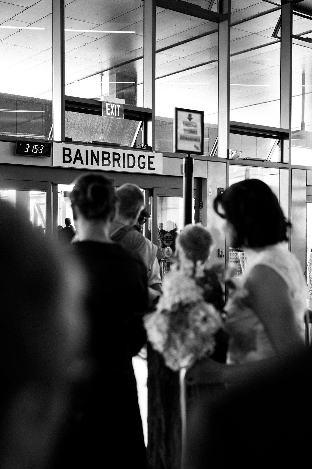 bride and guests going through ferry terminal to Bainbridge for ferry wedding