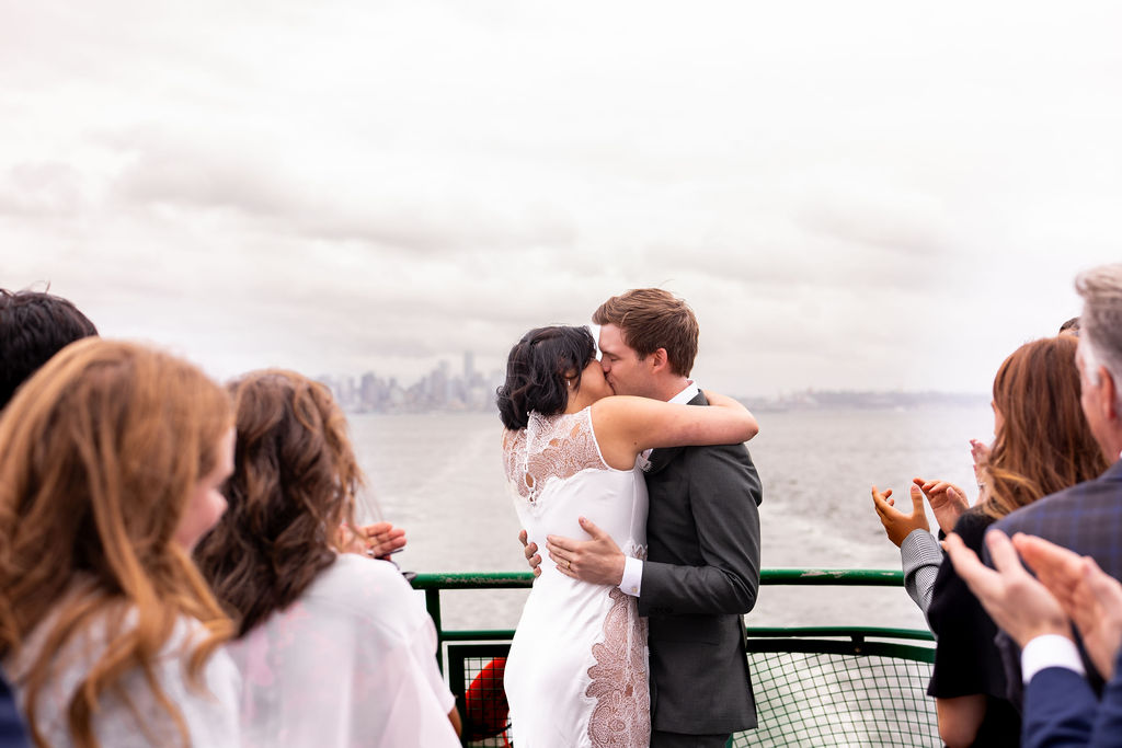 bride and groom first kiss on seattle ferry