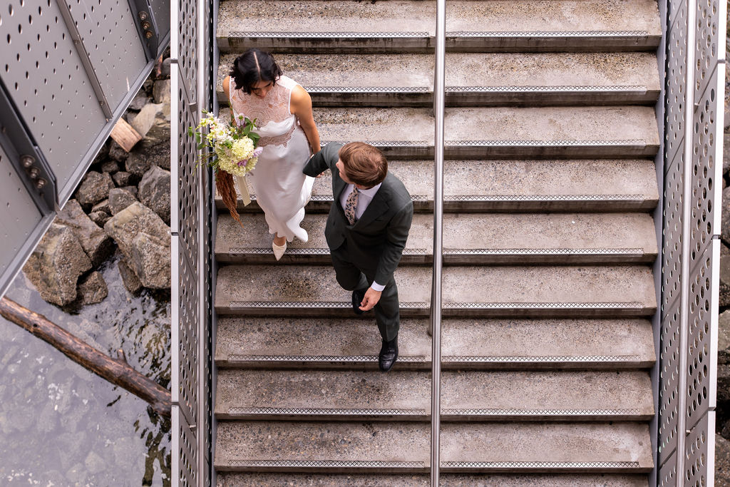 bride and groom walking down stairs