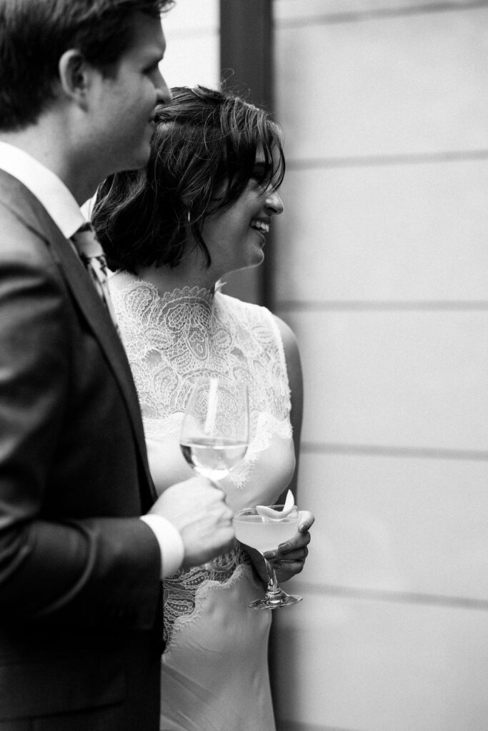 bride and groom listening to toasts