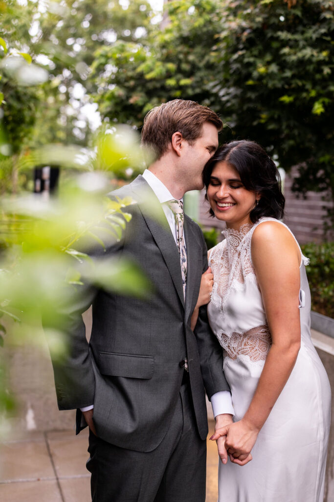 bride and groom snuggling 
