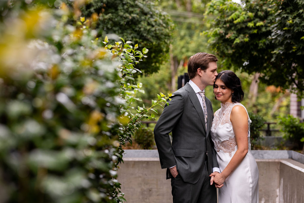 bride and groom snuggling 