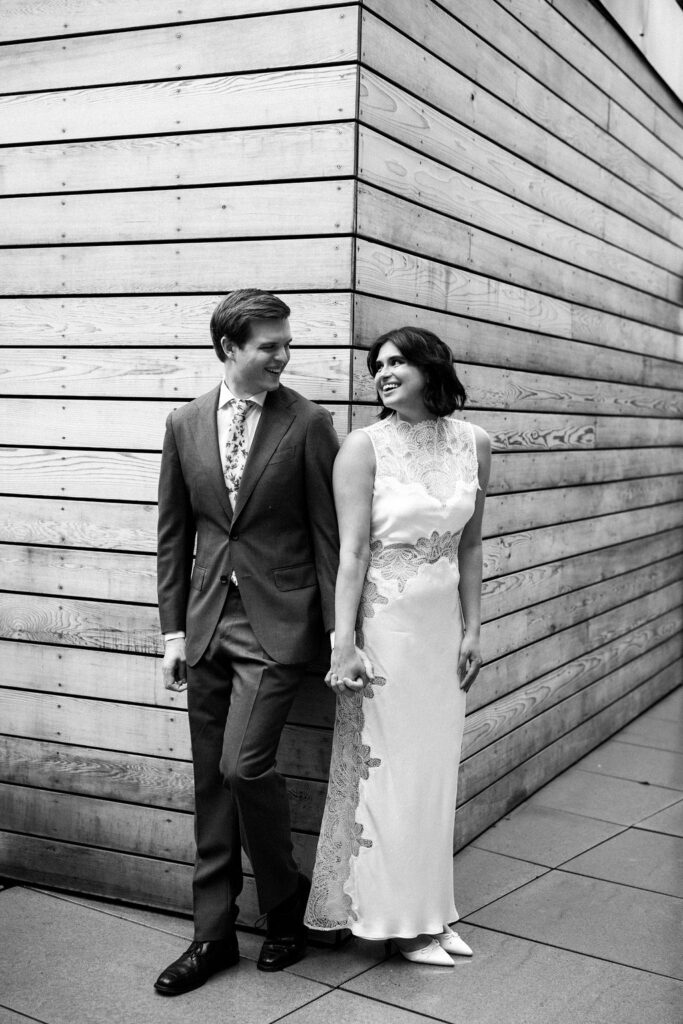 bride and groom on corner of building