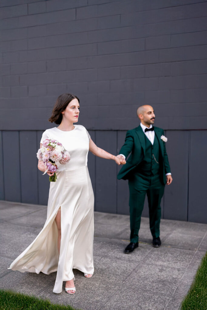 bride and groom pose together