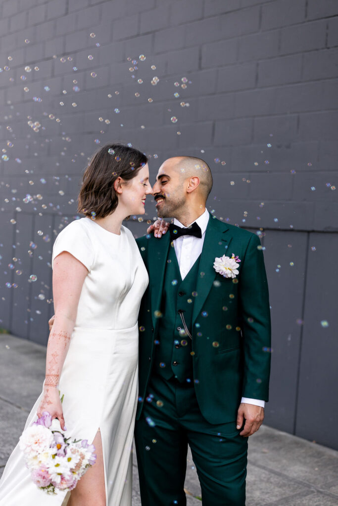 bride and groom pose together