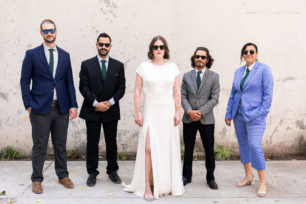 bride stands with the boys