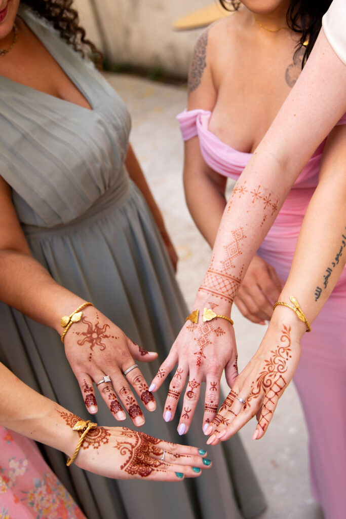 girls showing off henna