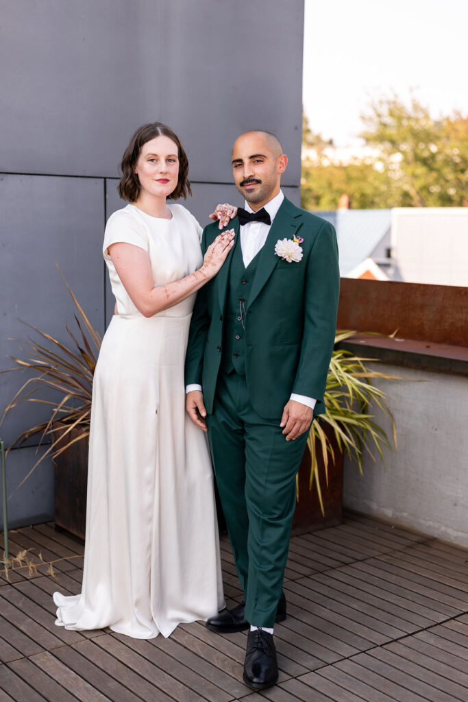 bride and groom pose together