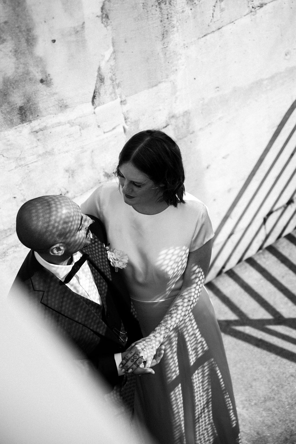 bride and groom pose together at fremont foundry stairs
